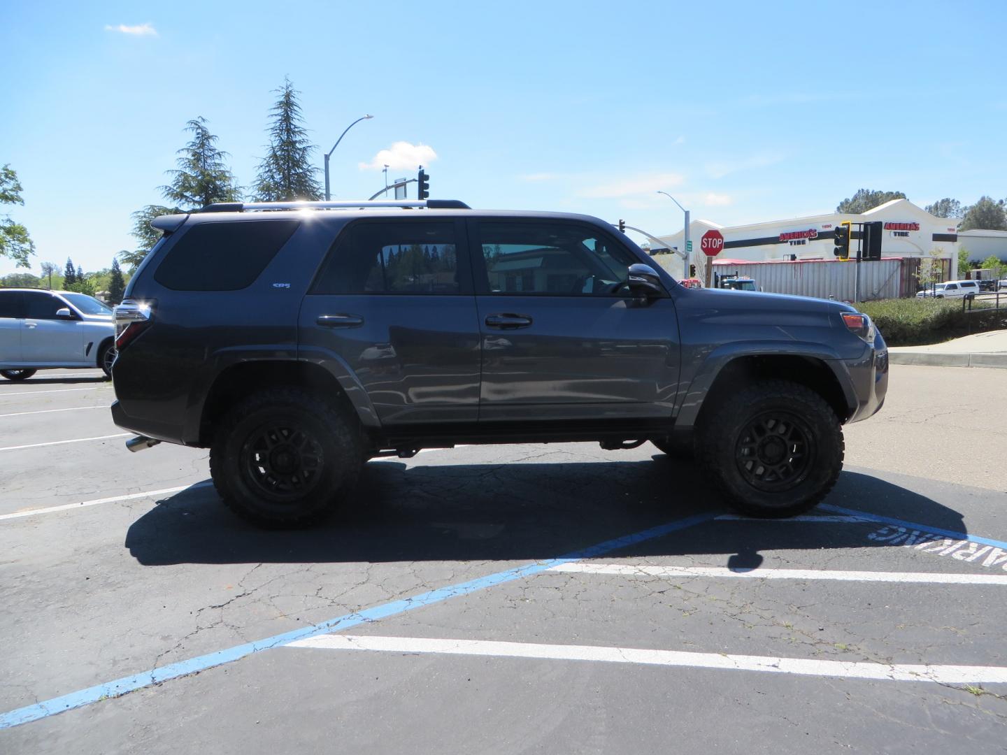 2021 CHARCOAL /BLACK Toyota 4Runner SR5 Premium 4WD (JTENU5JR0M5) with an 4.0L V6 DOHC 24V engine, 5A transmission, located at 2630 Grass Valley Highway, Auburn, CA, 95603, (530) 508-5100, 38.937893, -121.095482 - Clean SR5 Premium 7 passenger with a set of Bilstein 5100 series front struts and rear shocks, Bilstein 1" rear springs, 17" KMC 544 wheels, and Toyo RT Trail tires. - Photo#3